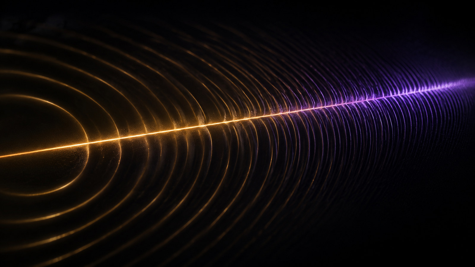 A thin luminous metal line on a dark substrate radiating soft concentric thermal waves that shorten as they brighten toward one edge
