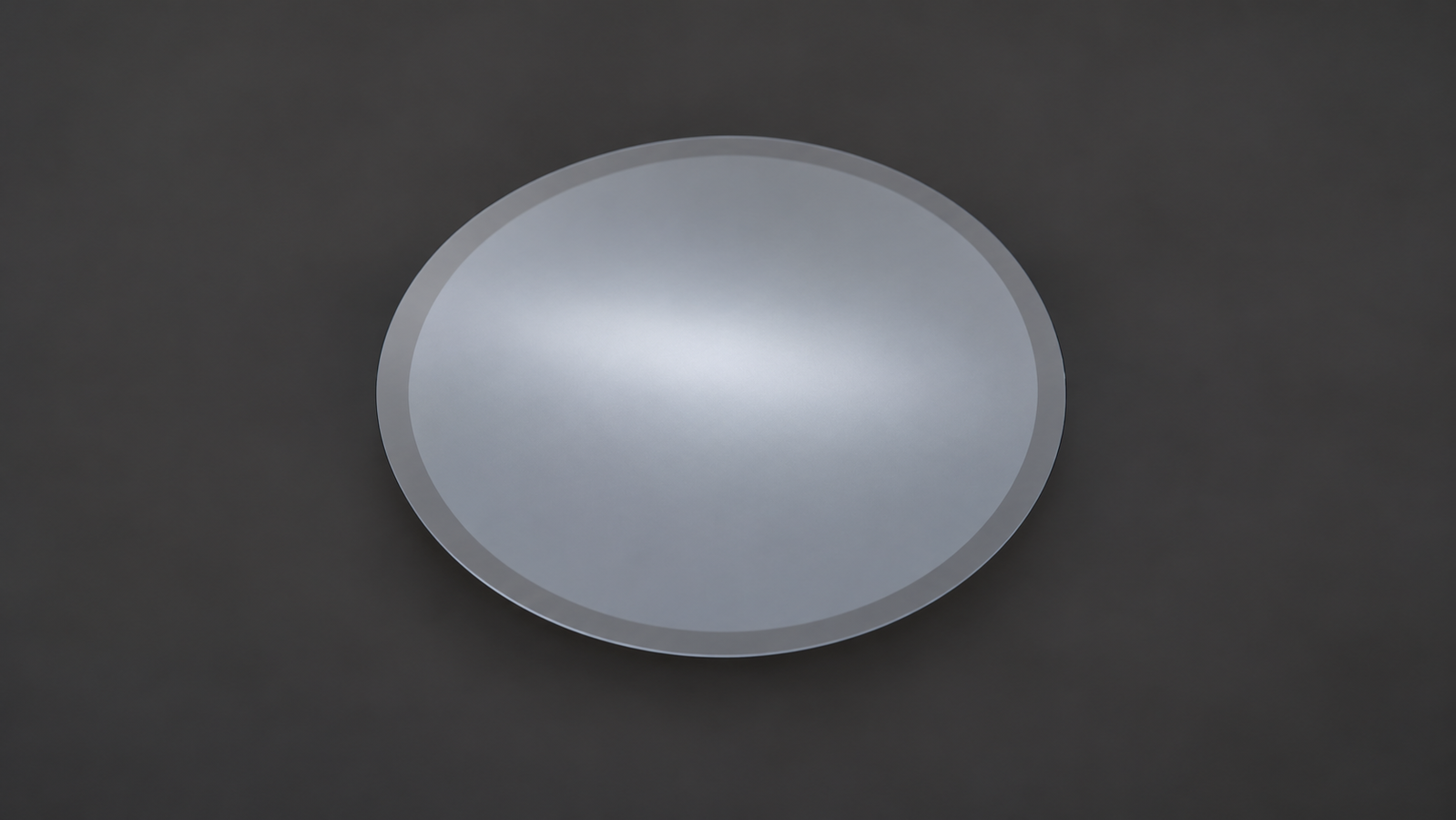 Resist-coated silicon wafer after edge bead removal, showing a narrow bare-silicon ring around the film